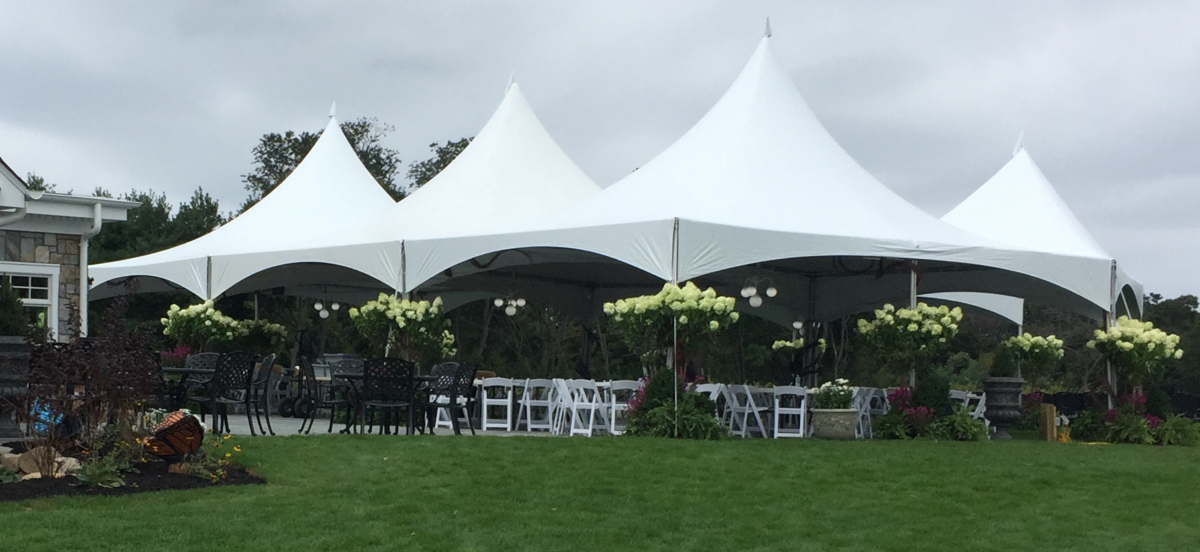 Large tent with lots of open flooring and large letters spelling person's name underneath