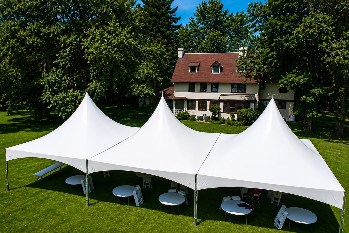 Large tent with lots of open flooring and large letters spelling person's name underneath